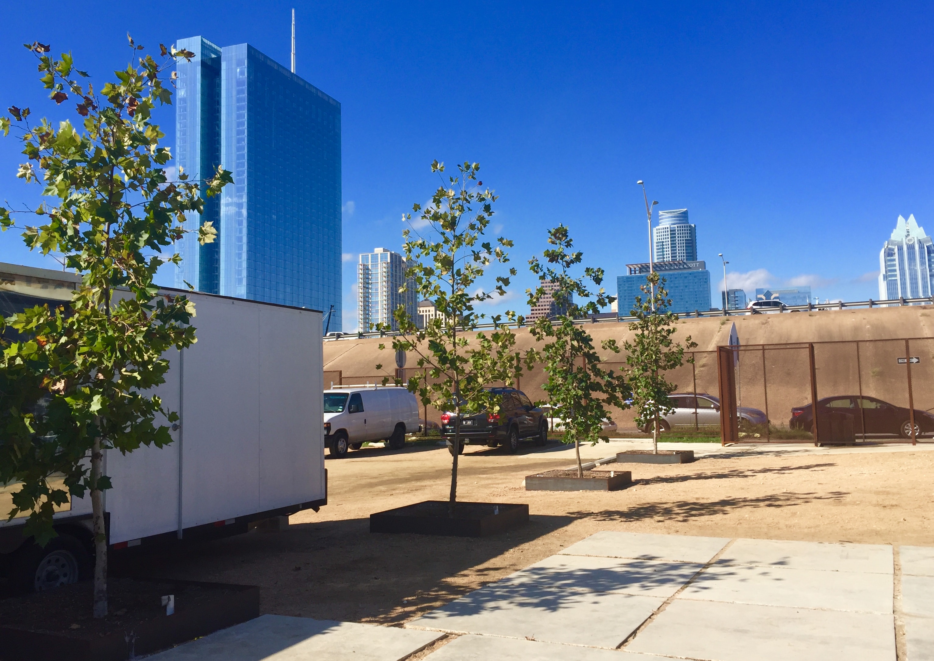 Peche restaurant corten steel planters with lush native plantings on 6th Street