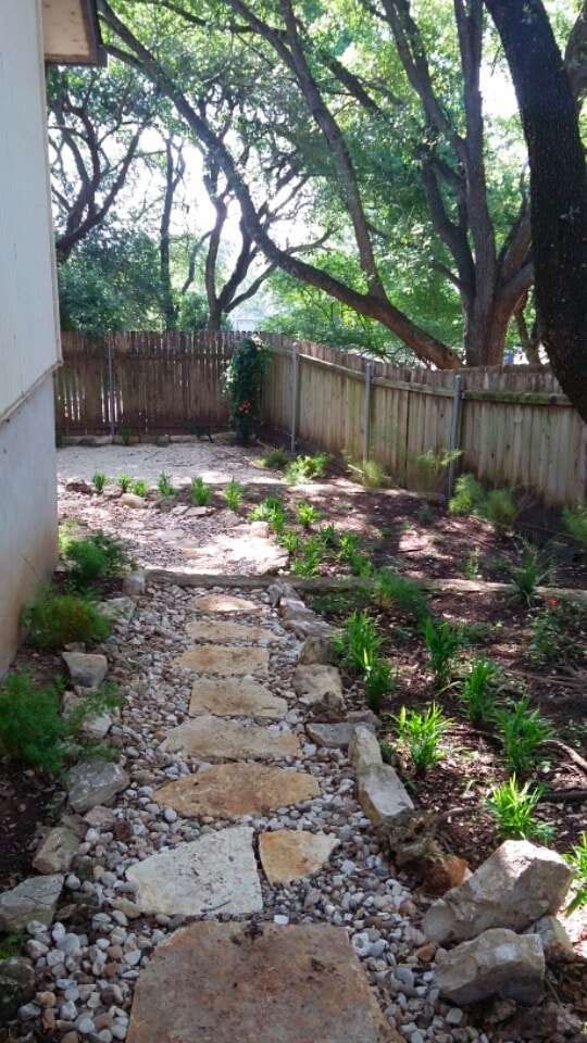 Backyard stone path and landscaping